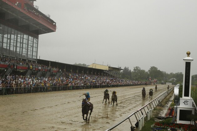 American Pharoah, ridden by Victor Espinoza  wins the 140th Preakness Stakes horse race at Pimlico Race Course, Saturday, May 16, 2015, in Baltimore. (AP Photo/Matt Slocum)