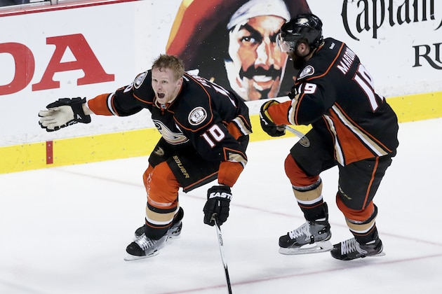 Anaheim Ducks right wing Corey Perry, left, celebrates his game winning goal the Patrick Maroon during overtime in Game 5 of an NHL hockey second-round playoff series against the Calgary Flames in Anaheim, Calif., Sunday, May 10, 2015. (AP Photo/Chris Carlson)
