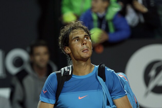 Spain's Rafael Nadal  leaves after losing the quarter final match against Switzerland's Stan Wawrinka at the Italian Open tennis tournament, in Rome, Friday, May 15, 2015.  Nadal has lost on clay for the fifth time this season. The Spaniard was beaten 7-6 (7), 6-2 by eighth-seeded Stan Wawrinka in the Italian Open quarterfinals Friday. (AP Photo/Alessandra Tarantino)