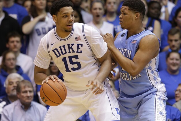 Duke's Jahlil Okafor (15) is pressured by North Carolina's Kennedy Meeks during the second half of an NCAA college basketball game in Durham, N.C., Wednesday, Feb. 18, 2015. Duke won 92-90 in overtime. (AP Photo/Gerry Broome)