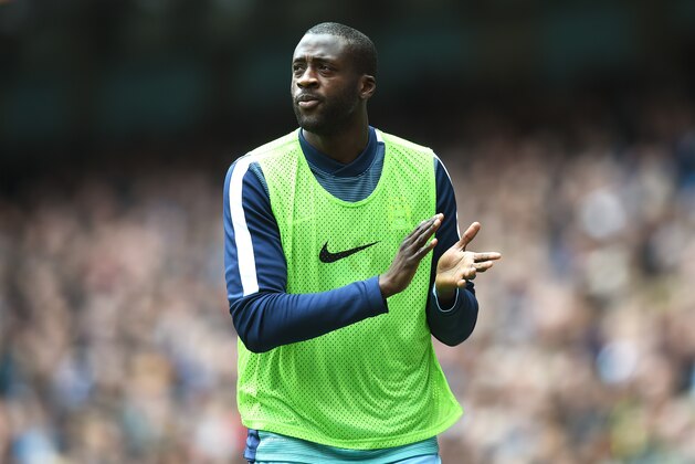 MANCHESTER, ENGLAND - MAY 10:  Yaya Toure of Manchester City applaudsthe fans as he warms up during the Barclays Premier League match between Manchester City and Queens Park Rangers at the Etihad Stadium on May 10, 2015 in Manchester, England.  (Photo by Michael Regan/Getty Images)
