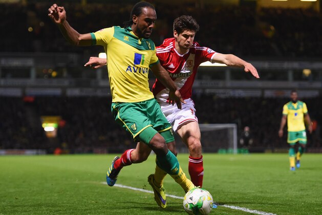 NORWICH, ENGLAND - APRIL 17:  Cameron Jerome of Norwich City takes on George Friend of Middlesbrough during the Sky Bet Championship match between Norwich City and Middlesbrough at Carrow Road on April 17, 2015 in Norwich, England.  (Photo by Tom Dulat/Getty Images)