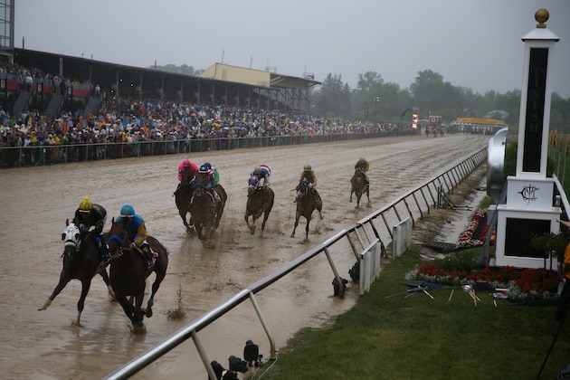 BALTIMORE, MD - MAY 16:  American Pharoah #1 ridden by Victor Espinoza leads the field into the first turn during the 140th running of the Preakness Stakes at Pimlico Race Course on May 16, 2015 in Baltimore, Maryland.  (Photo by Rob Carr/Getty Images)
