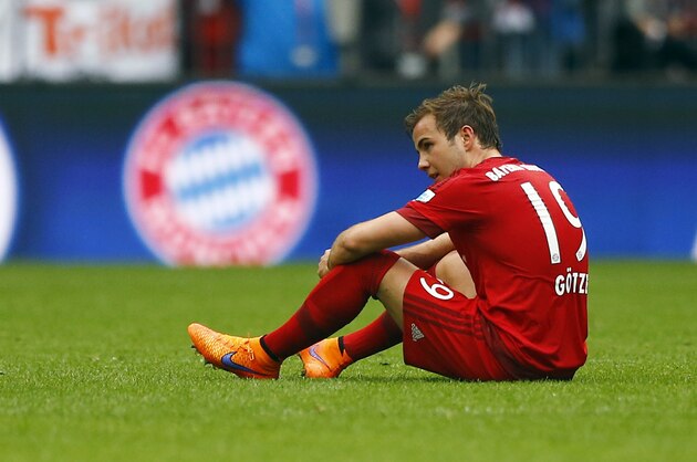 Bayern's Mario Goetze sits on the ground after the German first division Bundesliga soccer match between FC Bayern Munich and FC Augsburg at the Allianz Arena in Munich, Germany, on Saturday, May 9, 2015. (AP Photo/Matthias Schrader)