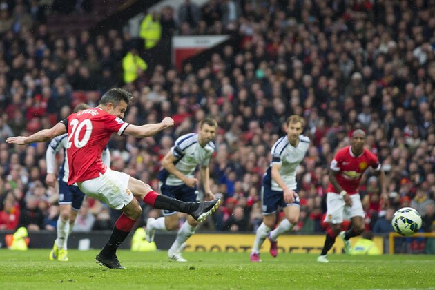 Manchester United's Robin van Persie misses a penalty  during the English Premier League soccer match between Manchester United and West Bromwich Albion at Old Trafford Stadium, Manchester, England, Saturday, May 2, 2015. (AP Photo/Jon Super)