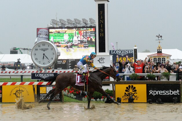 IMAGE DISTRIBUTED FOR LONGINES - American Pharoah, ridden by jockey Victor Espinoza, wins the second leg of the Triple Crown as he runs away with the 140th Preakness Stakes, Saturday, May 16, 2015, at a muddy Pimlico Race Course in Baltimore, Md. American Pharoah will be a contender for the Triple Crown at Belmont Park on June 6. Longines, the Swiss watch manufacturer known for its elegant timepieces, is the Official Watch and Timekeeper of the 140th annual Preakness Stakes and the Triple Crown. (Photo by Diane Bondareff/Invision for Longines/AP Images) IMAGE DISTRIBUTED FOR LONGINES - American Pharoah, ridden by jockey Victor Espinoza, wins the second leg of the Triple Crown as he runs away with the 140th Preakness Stakes, Saturday, May 16, 2015, at a muddy Pimlico Race Course in Baltimore, Md. American Pharoah will be a contender for the Triple Crown at Belmont Park on June 6. Longines, the Swiss watch manufacturer known for its elegant timepieces, is the Official Watch and Timekeeper of the 140th annual Preakness Stakes and the Triple Crown. (Photo by Diane Bondareff/Invision for Longines/AP Images)
