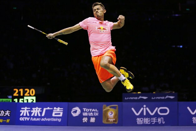 China's Lin Dan is airborne as he celebrates his win over Japan's Takuma Ueda in the final's of the Sudirman Cup badminton championships in Dongguan in southern China's Guangdong province, Sunday, May 17, 2015. (AP Photo/Kin Cheung)