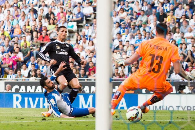 BARCELONA, SPAIN - MAY 17: Cristiano Ronaldo of Real Madrid CF scores the opening goal during the La Liga match between RCD Espanyol and Real Madrid CF at Cornella-El Prat Stadium on May 17, 2015 in Barcelona, Spain. (Photo by Alex Caparros/Getty Images)
