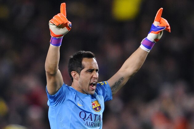 Barcelona's goalkeeper Claudio Bravo celebrates after Barcelona's Jeremy Mathieu scored the first goal during a Spanish La Liga soccer match between FC Barcelona and Real Madrid at Camp Nou stadium, in Barcelona, Spain, Sunday, March 22, 2015. (AP Photo/Manu Fernandez)