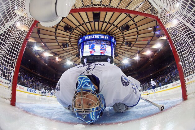 NEW YORK, NY - MAY 16: Ben Bishop #30 of the Tampa Bay Lightning stretches before the start of the third period in Game One of the Eastern Conference Finals against the New York Rangers during the 2015 NHL Stanley Cup Playoffs at Madison Square Garden on May 16, 2015 in New York City. The Rangers defeated the Lighting 2-1. (Photo by Bruce Bennett/Getty Images)