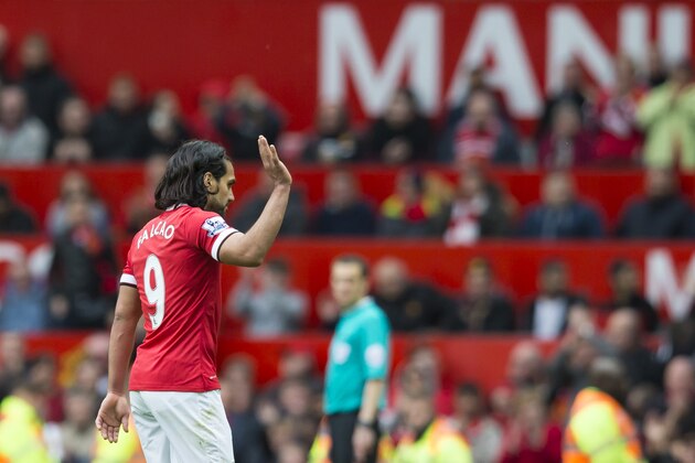 Manchester United's Radamel Falcao waves to supporters as he is substituted during the English Premier League soccer match between Manchester United and Arsenal at Old Trafford Stadium, Manchester, England, Sunday, May 17, 2015. (AP Photo/Jon Super)