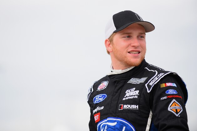 NEWTON, IA - MAY 16: Chris Buescher, driver of the #60 Roush Performance Products Ford Mustang Ford, on the grid during qualifying for the NASCAR XFinity Series 3M 250 at Iowa Speedway on May 16, 2015 in Newton, Iowa.  (Photo by Jonathan Moore/Getty Images)