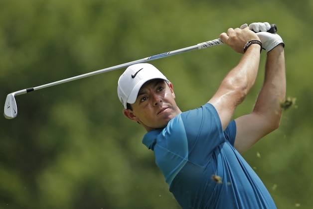 Rory McIlroy, of Northern Ireland, watches his tee shot on the second hole during the final round of the Wells Fargo Championship golf tournament at Quail Hollow Club in Charlotte, N.C., Sunday, May 17, 2015. (AP Photo/Chuck Burton)