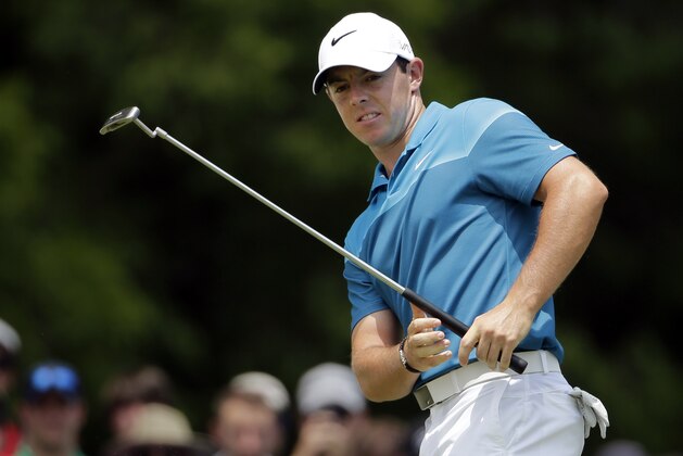 Rory McIlroy, of Northern Ireland, reacts as he misses a putt on the second hole during the final round of the Wells Fargo Championship golf tournament at Quail Hollow Club in Charlotte, N.C., Sunday, May 17, 2015. (AP Photo/Chuck Burton)