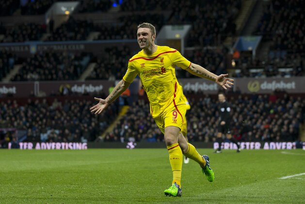 Liverpool's Rickie Lambert celebrates after scoring during the English Premier League soccer match between Aston Villa and Liverpool at Villa Park Stadium, Birmingham, England, Saturday Jan. 17, 2015. (AP Photo/Jon Super)