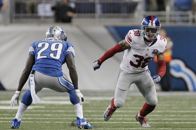 New York Giants' Trumaine McBride (38) breaks down the field against Detroit Lions' Cassius Vaughn (29) during the second quarter of an NFL football game in Detroit, Monday, Sept. 8, 2014. (AP Photo/Duane Burleson)