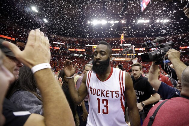 Houston Rockets guard James Harden (13) leaves the floor after Game 7 of the NBA basketball Western Conference semifinals against the Los Angeles Clippers Sunday, May 17, 2015, in Houston. Houston won 113-100. (AP Photo/David J. Phillip)