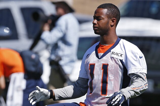 Denver Broncos Jordan Norwood stretches during an NFL football organized team practice at the Broncos training facility in Englewood, Colo., on Monday, June 2, 2014. (AP Photo/Ed Andrieski)