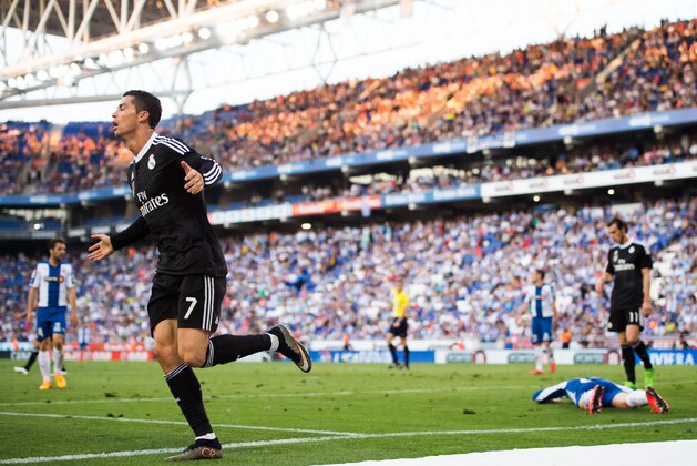 BARCELONA, SPAIN - MAY 17: Cristiano Ronaldo of Real Madrid CF celebrates after scoring his team's fourth goal during the La Liga match between RCD Espanyol and Real Madrid CF at Cornella-El Prat Stadium on May 17, 2015 in Barcelona, Spain. (Photo by Alex Caparros/Getty Images)