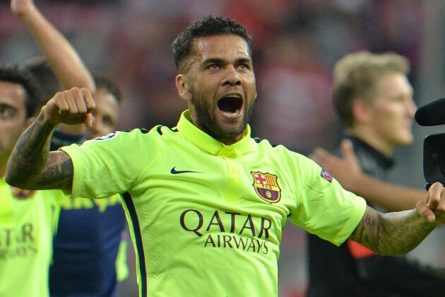 Barcelona's Dani Alves celebrates at the end of the soccer Champions League second leg semifinal match between Bayern Munich and FC Barcelona at Allianz Arena in Munich, southern Germany, Tuesday, May 12, 2015. (AP Photo/Kerstin Joensson)