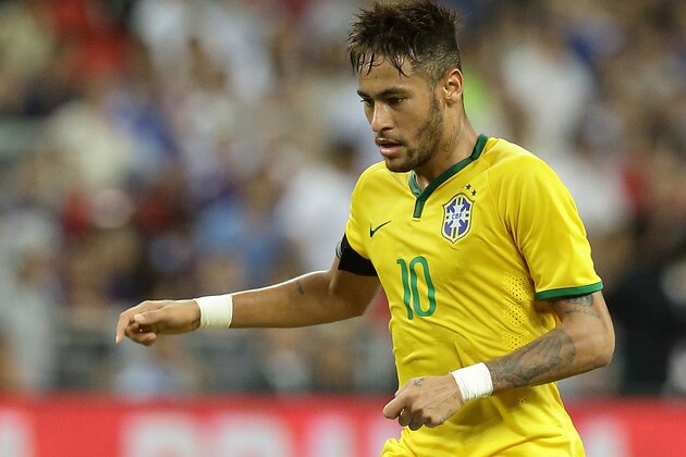 SINGAPORE - OCTOBER 14:  Neymar of Brazil in action during the international friendly match between Japan and Brazil at the National Stadium on October 14, 2014 in Singapore.  (Photo by Suhaimi Abdullah/Getty Images)