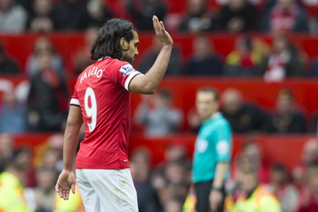 Manchester United's Radamel Falcao waves to supporters as he is substituted during the English Premier League soccer match between Manchester United and Arsenal at Old Trafford Stadium, Manchester, England, Sunday, May 17, 2015. (AP Photo/Jon Super)