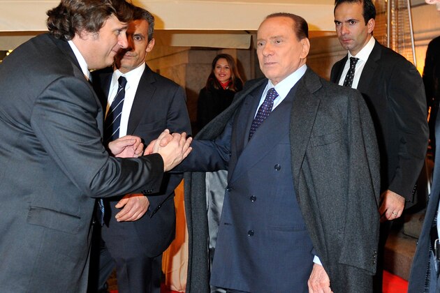MILAN, ITALY - DECEMBER 14:  Silvio Berlusconi leaves after the AC Milan Christmas Party at the Royal Pavilion at the Central Station on December 14, 2011 in Milan, Italy.  (Photo by Claudio Villa/Getty Images)