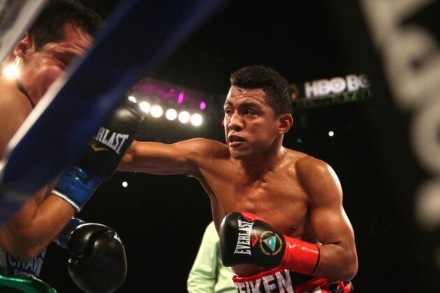 INGLEWOOD, CA - MAY 16:  Roman Gonzalez (R) throws a punch in the sequence that knocked out Edgar Sosa in their WBC Flyweight World Championship fight at The Forum on May 16, 2015 in Inglewood, California. Gonzalex won in a second round knockout.  (Photo by Stephen Dunn/Getty Images)