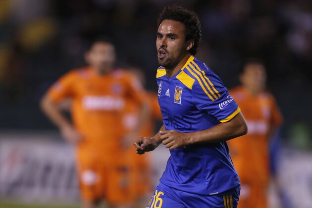 Enrique Esqueda of Mexico's Tigres celebrates after scoring against  Bolivia's Universitario de Sucre during a Copa Libertadores soccer match in Sucre, Bolivia, Tuesday, April 28, 2015. (AP Photo/Juan Karita)