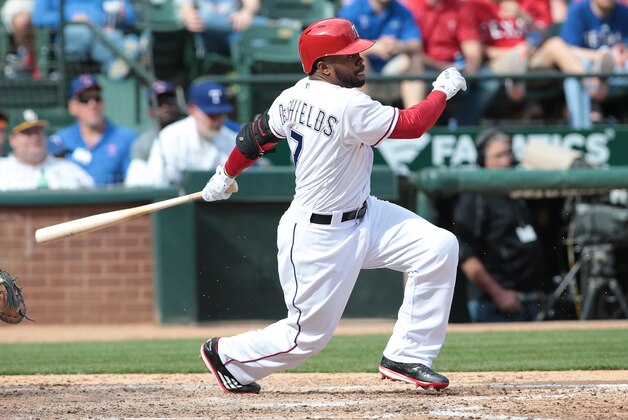 ARLINGTON, TX - APRIL 10: Delino DeShields Jr. #7 of the Texas Rangers hits a fielders choice against the Houston Astros for Adrian Beltre #29 to score in the sixth inning on Rangers opening day game at Globe Life Park in Arlington on April 10, 2015 in Arlington, Texas.  (Photo by Rick Yeatts/Getty Images)