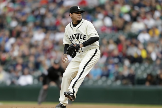 Seattle Mariners starting pitcher Felix Hernandez in action against the Boston Red Sox in a baseball game on Saturday, May 16, 2015, in Seattle. Both teams are wearing uniforms of Negro League teams of 1946, Seattle is the Seattle Steelheads and Boston that of the Boston Giants. (AP Photo/John Froschauer)