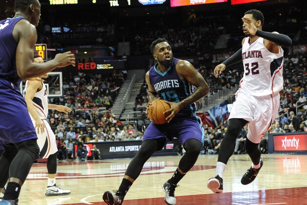 Charlotte Hornets guard P.J. Hairston (19) and Atlanta Hawks forward Mike Scott (32) are seen during an NBA basketball game, Friday, April 10, 2015, in Atlanta. (AP Photo/John Amis)