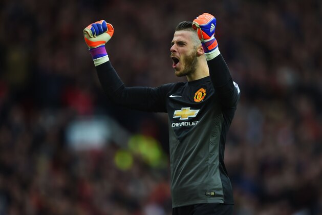 MANCHESTER, ENGLAND - MAY 17:  David De Gea of Manchester United celebrates as Ander Herrera scores their first goal during the Barclays Premier League match between Manchester United and Arsenal at Old Trafford on May 17, 2015 in Manchester, England.  (Photo by Shaun Botterill/Getty Images)