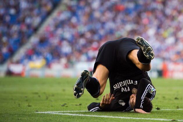 BARCELONA, SPAIN - MAY 17: Cristiano Ronaldo of Real Madrid CF falls during the La Liga match between RCD Espanyol and Real Madrid CF at Cornella-El Prat Stadium on May 17, 2015 in Barcelona, Spain. (Photo by Alex Caparros/Getty Images)
