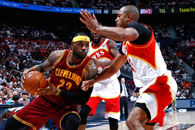ATLANTA, GA - MARCH 06:  Al Horford #15 of the Atlanta Hawks defends against LeBron James #23 of the Cleveland Cavaliers at Philips Arena on March 6, 2015 in Atlanta, Georgia.  NOTE TO USER: User expressly acknowledges and agrees that, by downloading and/or using this photograph, user is consenting to the terms and conditions of the Getty Images License Agreement.  (Photo by Kevin C. Cox/Getty Images)