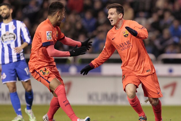 Barcelona's Lionel Messi, right, celebrates after scoring against Deportivo with teammate Neymar during a Spanish La Liga soccer match at the Riazor stadium in A Coruna, Spain, Sunday, Jan. 18, 2015. (AP Photo/Lalo R. Villar)