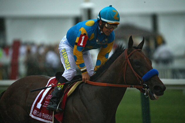 BALTIMORE, MD - MAY 16:  American Pharoah #1 ridden by Victor Espinoza crosses the finish line to win the 140th running of the Preakness Stakes at Pimlico Race Course on May 16, 2015 in Baltimore, Maryland.  (Photo by Patrick Smith/Getty Images)