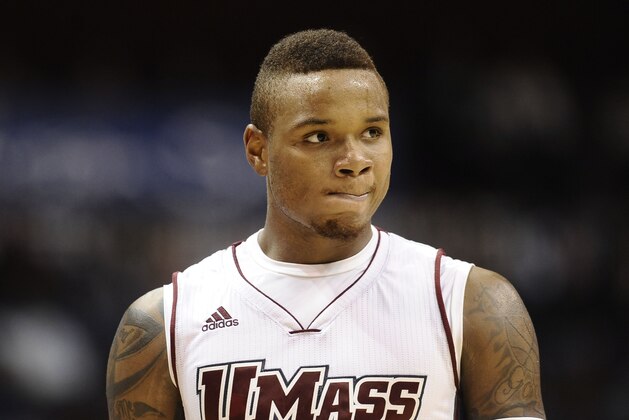 FILE - In this Nov. 22, 2014, file photo, Massachusetts’ Derrick Gordon looks on during the second half of an NCAA college basketball game in Uncasville, Conn. Gordon became a better basketball player and a better teammate this season, and he credits both to having the courage to play as an openly gay man. Gordon's first season since coming out likely ended Thursday in the first round of the Atlantic 10 tournament at Barclays Center. (AP Photo/Jessica Hill, File)