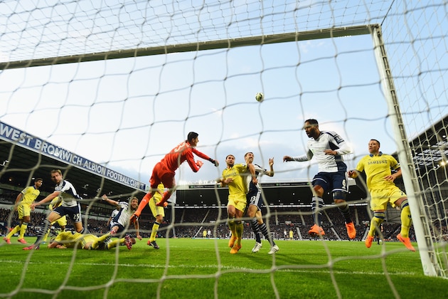 WEST BROMWICH, ENGLAND - MAY 18:  Goalkeeper Thibaut Courtois of Chelsea punches the ball clear during the Barclays Premier League match between West Bromwich Albion and Chelsea at The Hawthorns on May 18, 2015 in West Bromwich, England.  (Photo by Shaun Botterill/Getty Images)