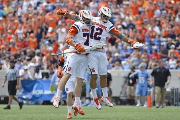 May 17, 2015; Annapolis, MD, USA;  Syracuse Orange midfielder Henry Schoonmaker (77) celebrates with  midfielder Derek DeJoe (12) after scoring a first quarter goal against against the Johns Hopkins Blue Jays at Navy Marine Corps Memorial Stadium. Mandatory Credit: Tommy Gilligan-USA TODAY Sports