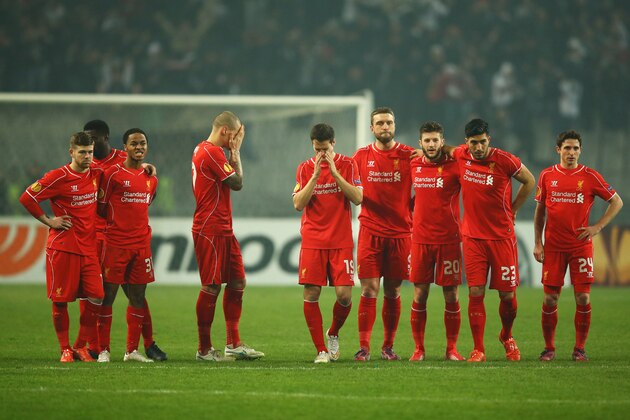 ISTANBUL, TURKEY - FEBRUARY 26:  Liverpool players look dejected as Dejan Lovren of Liverpool misses the decisive kick in the penalty shoot out during the UEFA Europa League Round of 32 second leg match between Besiktas JK and Liverpool FC on February 26, 2015 in Istanbul, Turkey.  (Photo by Richard Heathcote/Getty Images)