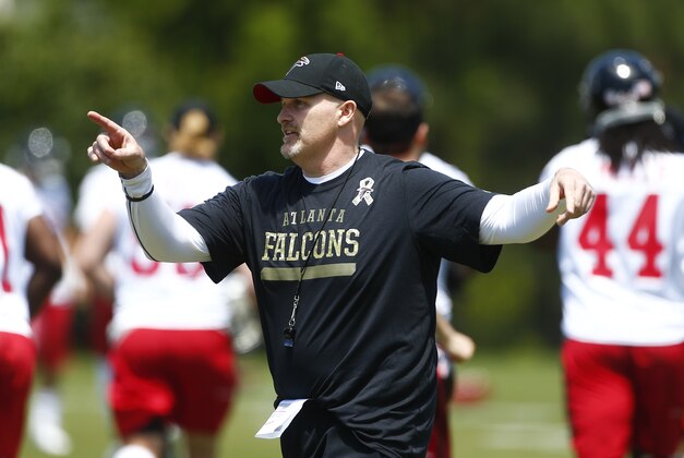 Atlanta Falcons head coach Dan Quinn direct his team during an NFL football minicamp practice  Tuesday, April 28, 2015, in Flowery Branch, Ga. The workout was Quinn's first as head coach. (AP Photo/John Bazemore)