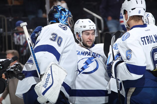 NEW YORK, NY - MAY 18:  Ben Bishop #30 and Tyler Johnson #9 of the Tampa Bay Lightning celebrate after a 6-2 win over the New York Rangers in Game Two of the Eastern Conference Final during the 2015 NHL Stanley Cup Playoffs at Madison Square Garden on May 18, 2015 in New York City. (Photo by Jared Silber/NHLI via Getty Images)