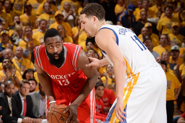 OAKLAND, CA - MAY 19: James Harden #13 of the Houston Rockets defends the ball against Klay Thompson #11 of the Golden State Warriors during Game One of the Western Conference Finals during the NBA Playoffs on May 19, 2015 at ORACLE Arena in Oakland, California.  NOTE TO USER: User expressly acknowledges and agrees that, by downloading and or using this Photograph, user is consenting to the terms and conditions of the Getty Images License Agreement.  Mandatory Copyright Notice: Copyright 2015 NBAE (Photo by Noah Graham/NBAE via Getty Images)