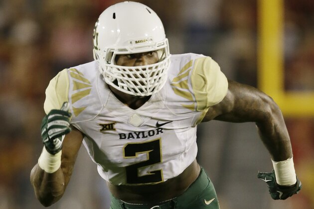 Baylor defensive end Shawn Oakman runs up field during the first half of an NCAA college football game against Iowa State, Saturday, Sept. 27, 2014, in Ames, Iowa. (AP Photo/Charlie Neibergall)