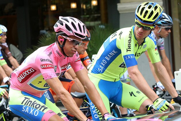 Spain's Alberto Contador, wearing the pink jersey of leader of the race, and his teammate  Michael Rogers, of Australia,  pedal during the 11th stage of the Giro D'Italia, Tour of Italy cycling race, from Forli' to Imola, Italy, Wednesday, May 20, 2015. (Claudio Peri/ANSA via AP)