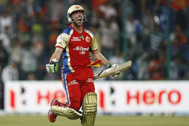 Royal Challengers Bangalore batsman AB de Villiers celebrates their win over Pune Warriors in the Indian Premier League (IPL) cricket match in Bangalore, India, Tuesday, April 17, 2012. Royal Challengers Bangalore won the match by six wickets. (AP Photo/Aijaz Rahi)