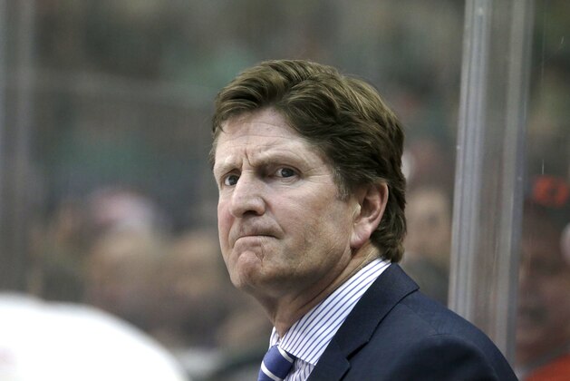 Detroit Red Wings head coach Mike Babcock watches from the bench during an NHL hockey game against the Dallas Stars Saturday, Feb. 21, 2015, in Dallas. (AP Photo/LM Otero)