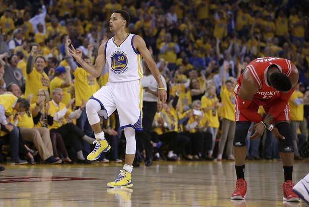 Golden State Warriors' Stephen Curry, left, celebrates beside Houston Rockets' Dwight Howard after a score during the first quarter of Game 1 of the NBA basketball Western Conference finals Tuesday, May 19, 2015, in Oakland, Calif. (AP Photo/Ben Margot)