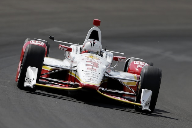 Helio Castroneves, of Brazil, steers his car during practice for the Indianapolis 500 auto race at Indianapolis Motor Speedway in Indianapolis, Friday, May 15, 2015. (AP Photo/Darron Cummings)